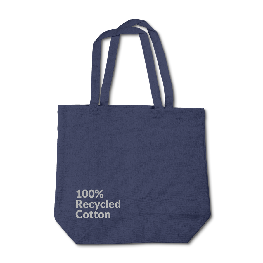 A Navy Recycled Cotton Tote with the words 100% Recycled Cotton screen printed on the surface.